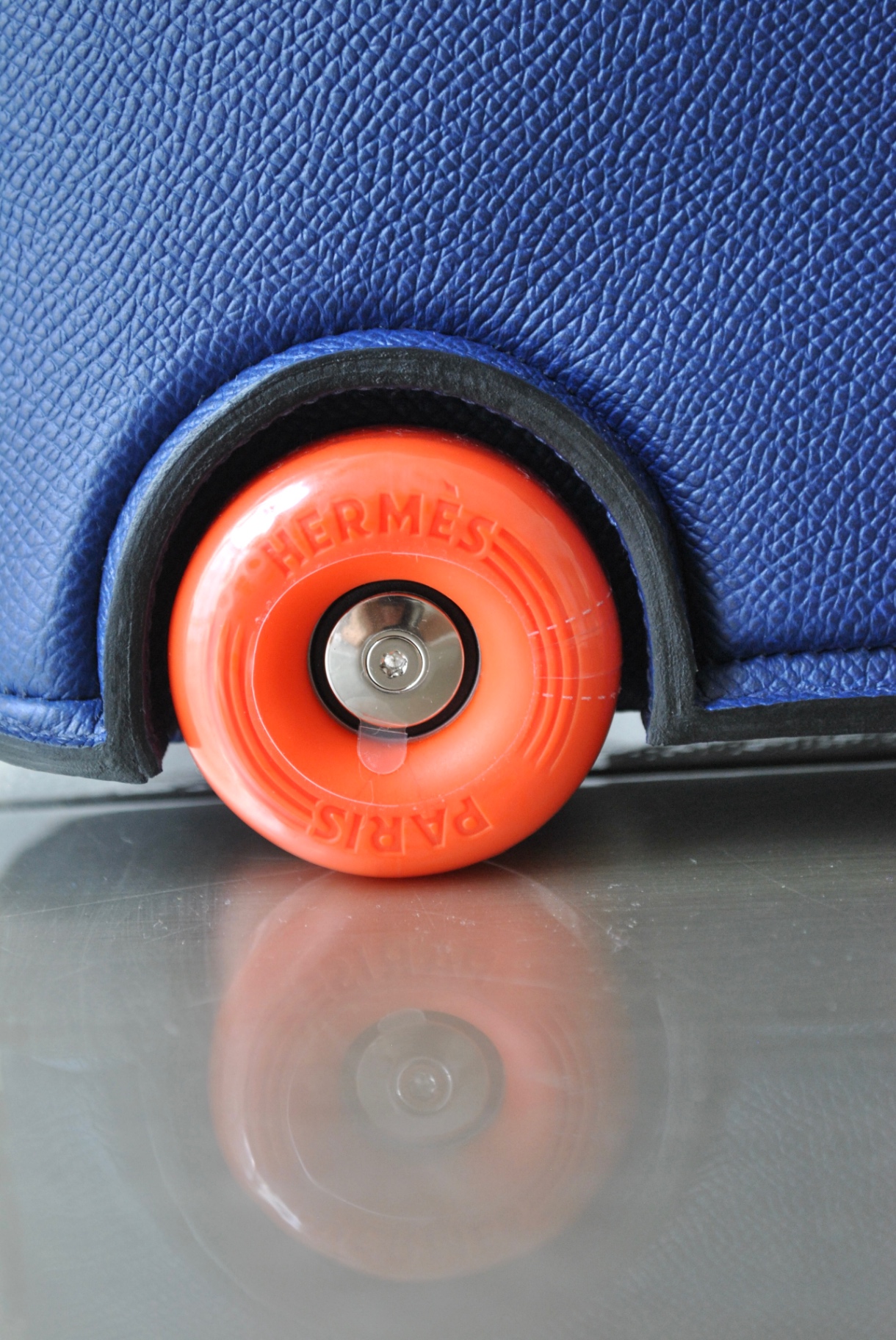 Base stud and rolled edge on electric blue epsom leather